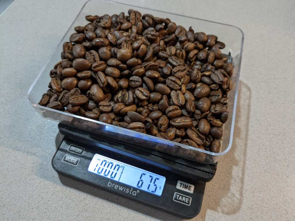 67.5 gr of coffee beans on a scale