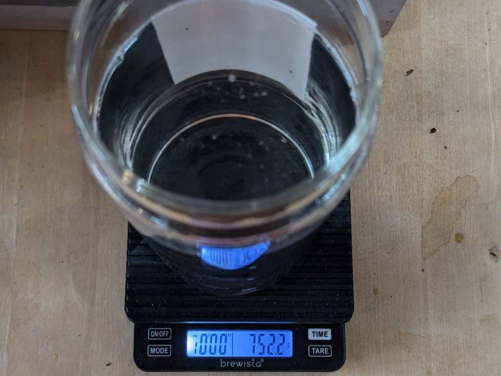 looking down a flask with 752 ml of cold water on a scale